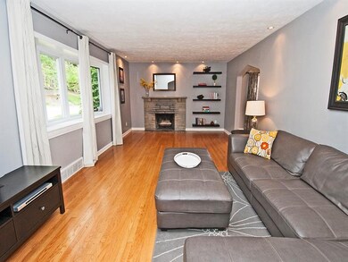 Neutral dcor and gleaming hardwood floors, with a 