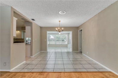 Dining area off main living room. Entry to the kit
