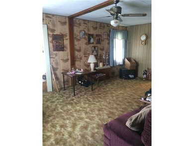 large living room with sun room off of it