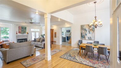 Another view of the formal dining room and front living room space. I love the tall ceilings and the hardwood flooring you will find throughout this fine home.