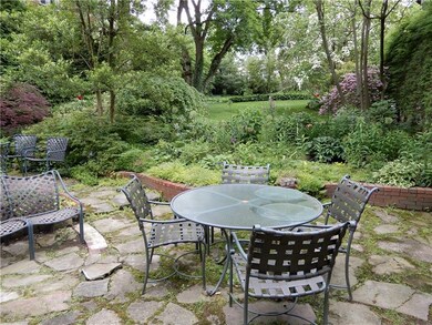The deep back yard has a constantly changing palat