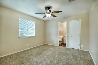 Unfurnished bedroom with carpet floors, baseboard