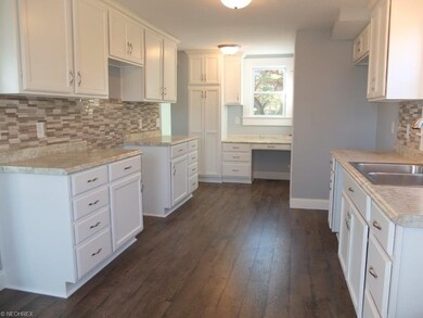 New flooring, new sink and new faucet in remodeled