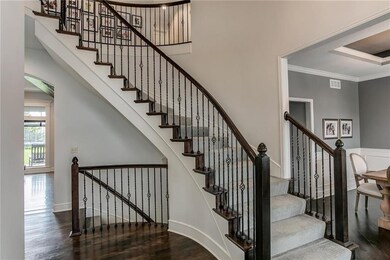 Enter into the grand 2-story foyer and notice the 
