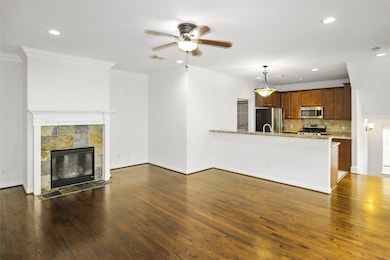 Cozy up to the elegant gas log fireplace, perfect for creating a warm and inviting atmosphere.