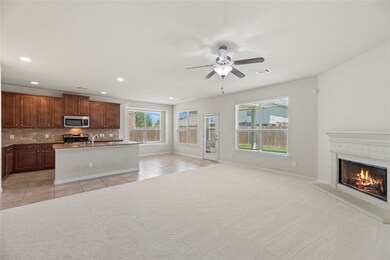 This room is perfect for all of the excitement and laughter that will fill this room. A beautiful open space for creating an abundance of memories. The fireplace sets the right mood for capturing all those special moments.