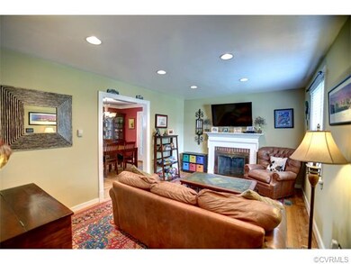 Family room with hardwood floor, recessed lighting