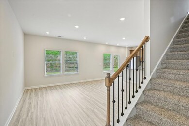 Staircase featuring baseboards, recessed lighting,