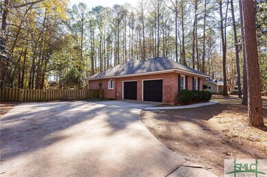 Large Paved driveway and entrance to oversized dou