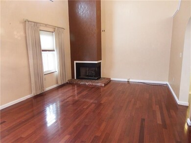 living room with fireplace, beautiful hardwood flo