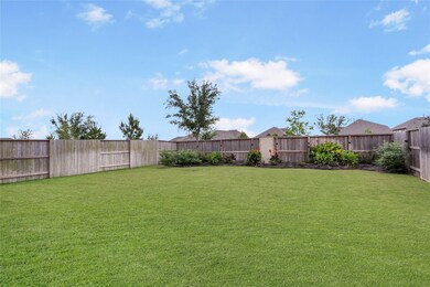 Beautifully landscaped oversized back yard with no