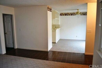 A view from the Living room shows the tiled entryw