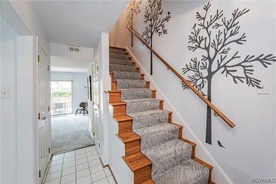 From foyer featuring light tile flooring to stairw