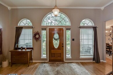 The large arched windows stream plenty of sunshine into this lovely entry way.