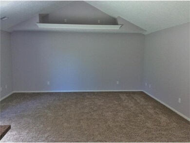 living room with vaulted ceilings
