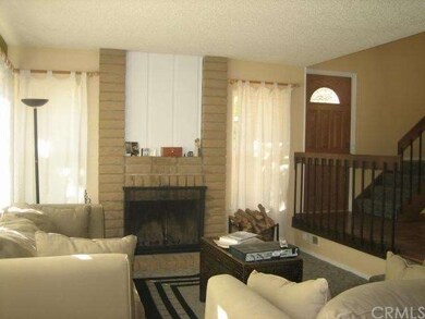 Living room with wood burning fireplace