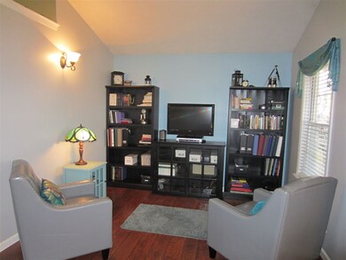 The Living/Dining Rooms have vaulted ceilings.