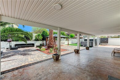 View of patio featuring a gazebo, a fenced backyar