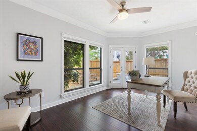 This bright and inviting home office features larg