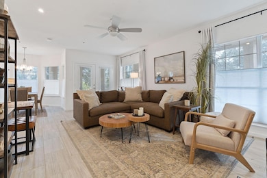 Living room with lots of natural light (windows) and beautiful floors.  Looking East and Southeast.