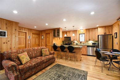 Living room with light wood-style flooring, recess