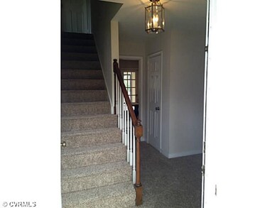 Foyer - New carpet and light fixture in foyer.