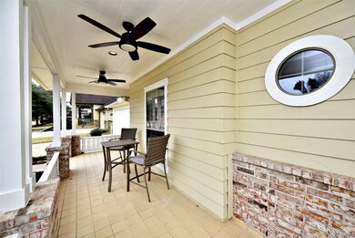 Another view of the front porch.  Brick accents and tile flooring add a custom touch to the finish.