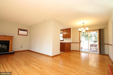 Living room opens to the dining area and kitchen.  Sliding doors lead to the deck in back.