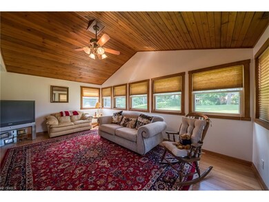 Sun room addition with knotty pine ceiling and mul