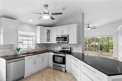 Kitchen featuring tasteful backsplash, stainless s