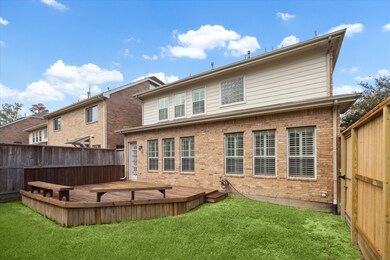 Enjoy the sizable, fenced backyard with wood deck