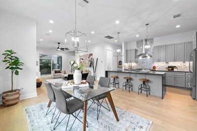 Dining area with recessed lighting, ceiling fan w