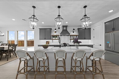 Kitchen with striking pendant lighting