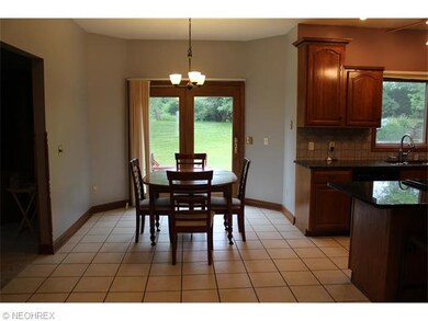 The great room is open to the beautiful kitchen wi