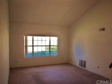Living room with vaulted ceilings