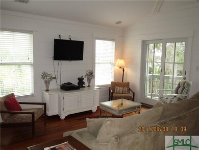 Living room with vaulted ceilings, hardwood floori