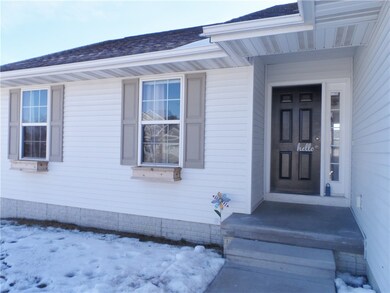 Charming window boxes and covered front entryway.