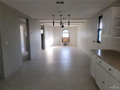 Unfurnished dining area featuring light tile patterned floors