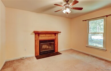 Inviting Family Room with wood-burning fireplace a