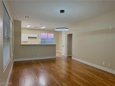 Spare room with light wood-style flooring and baseboards