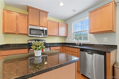Granite Countertops, Maple Cabinets