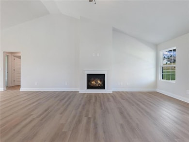 Unfurnished living room with light wood-type floor