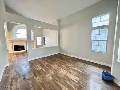 Unfurnished living room with dark wood-style floor