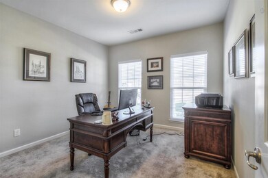 1 of 3 bedrooms on the main floor is currently being used as a private home office.