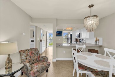 Dining room with light tile patterned flooring, a