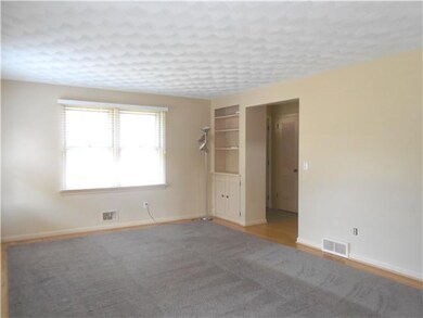 Living Room. Large living rm features buit-in book