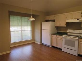 Kitchen with breakfast area and new flooring.
