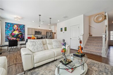 Living room with recessed lighting, visible vents,