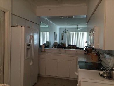 Kitchen is cozy and well lit.