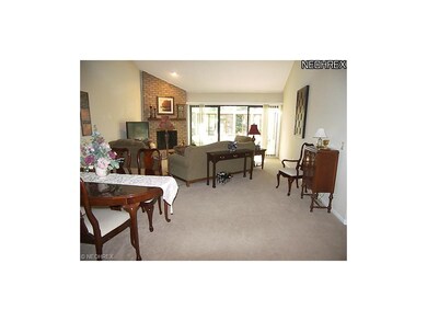 The two story great room features a brick to ceili
